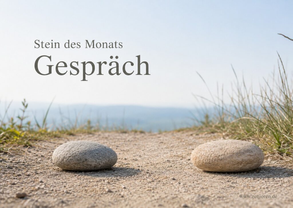 Zwei naturbelassene Steine mit offenem Zwischenraum auf hellem Weg im Morgenlicht, Zenioren Stein des Monats „Gespräch“.